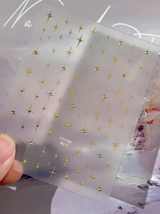 Detail of YT7708 gold star nail art stickers with tiny rhinestones on matte base