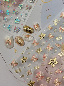 Detail of 3D embossed butterfly and flower nail art stickers with holographic texture