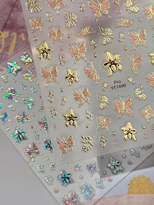 Detail of YT7490 butterfly nail stickers with gold embossed and laser iridescent effects