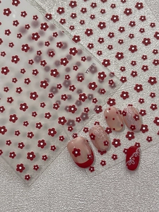 Detailed relief flower nail stickers featuring red floral designs and white dot accents