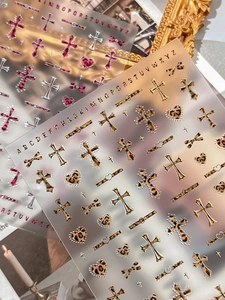 Detailed sheet of leopard print cross and letter nail art stickers for professional manicure