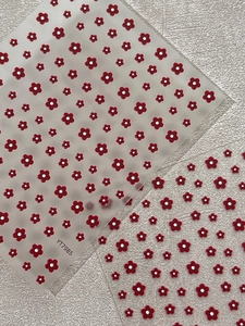 Detailed macro view of embossed red floral nail stickers YT7985 with matte textures