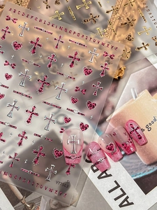Pink leopard print nail stickers with cross and heart designs in Y2K aesthetic style