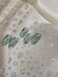 Detailed view of YT7052 3D gold and silver sun moon star nail stickers on blue nails