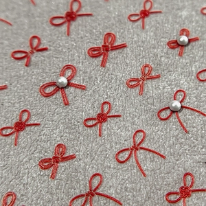 Red bow nail art stickers with pearls featuring traditional Chinese style embroidery