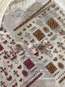 3D embossed leopard print nail art stickers with metallic silver cross and heart designs