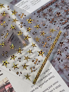 Detail of leopard print nail stickers with metallic stars and bows on YT7548 model sheet