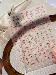 Detailed holographic bowknot nail stickers with pink and brown laser glitter patterns