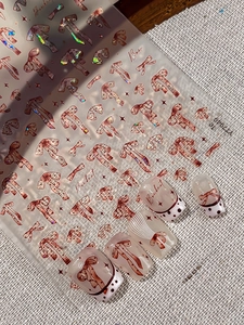 Detail of glitter bowknot nail stickers with French polka dot pattern effects