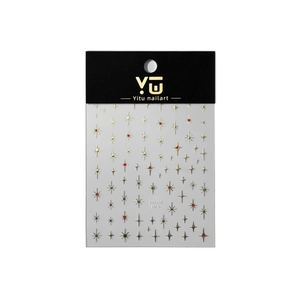 Self-adhesive gold starburst nail stickers with red accents on transparent sheet