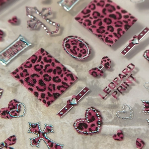 Pink leopard print nail art stickers with cross and heart shapes and silver metal edges