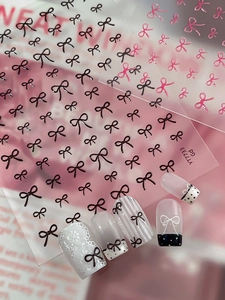 Vue détaillée des autocollants à ongles YT7733 avec motifs de nœuds roses et noirs