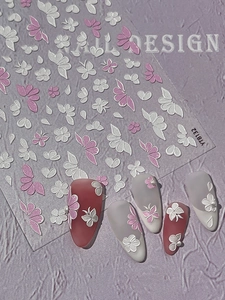 Detail view of 5D embossed floral nail art stickers with pink butterfly patterns
