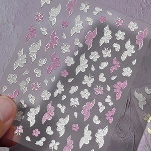 5D embossed nail stickers featuring pink and white butterfly and flower patterns