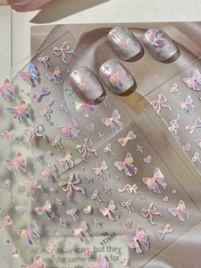 Detailed holographic laser bow and star nail art stickers with iridescent 3D effect