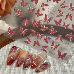 Holographic butterfly nail stickers with glitter textures and 3D floral accent art