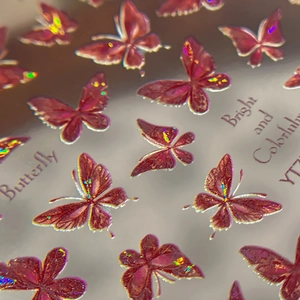 Luminous laser butterfly nail art stickers with vibrant red iridescent holographic finish