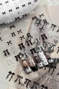 Detail view of YT7612 nail stickers featuring black and white bowknot and polka dot designs