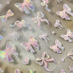 Iridescent cartoon bow nail art stickers with holographic laser effect and 3D relief design