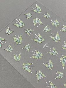 Close-up of YT6330 green butterfly nail art stickers with intricate white border details