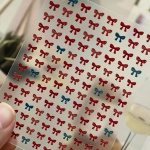 Bow tie 3D embossed nail art stickers in red and blue glitter for DIY manicure designs
