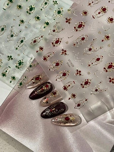 Detailed view of 3D Baroque nail stickers with gold gilding and faux gemstone designs
