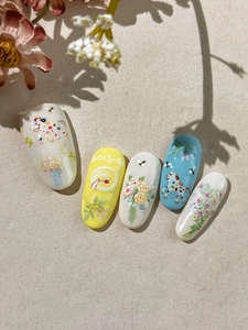 Detail of floral nail art stickers featuring cute ponies and French straw hat designs