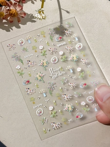 Detail of 3D embossed nail art stickers with vintage floral and pony designs