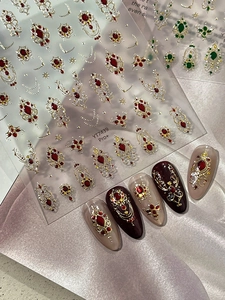Macro detail of YT7439 Pro+ baroque nail stickers with red gems and gold gilding