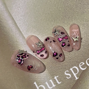Nude pink leopard heart press-on nails with silver star and butterfly charms