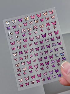 Detailed close-up of iridescent laser butterfly nail art stickers with holographic effects