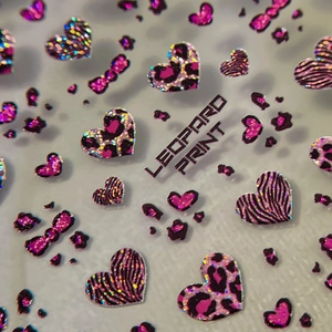 Hot pink and black leopard print heart nail art stickers with glitter bow designs