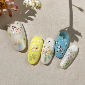 3D embossed spring nail art with cute unicorn, floral patterns and Hello Spring text