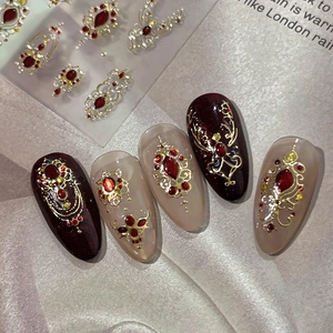Vintage Baroque press-on nails with wine red finish, gold relief, and ruby rhinestones