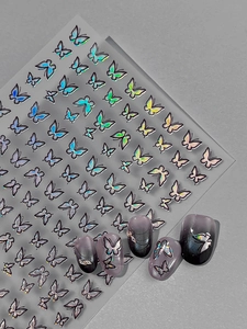 Detailed view of holographic butterfly nail stickers with colorful aurora effect for DIY