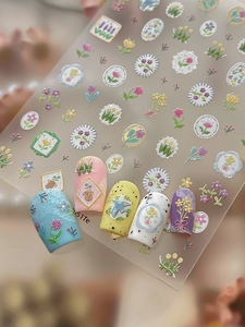 Detail of 3D embossed floral nail stickers featuring vintage garden patterns and frames
