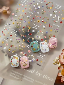 Detailed view of floral 5D embossed nail art stickers with vintage flower wreaths