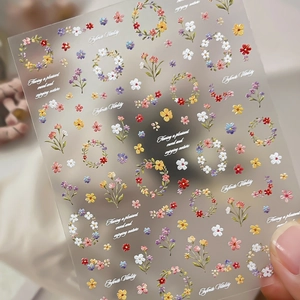 Nail art stickers with colorful spring floral motifs and circular flower wreaths