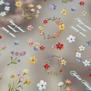 Micro-embossed spring floral nail art stickers with colorful flower wreaths and artistic text