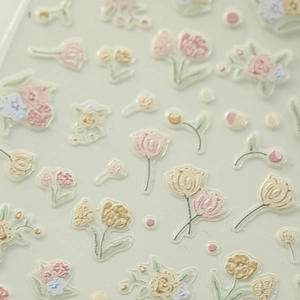 Macro detail of 3D embossed tulip flower nail art stickers with delicate raised textures