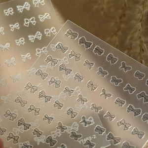 Macro detail of YT493 adhesive nail art stickers with black and white bow line designs