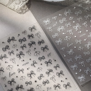 5D embossed nail art stickers with black and white lace bow designs and love letters