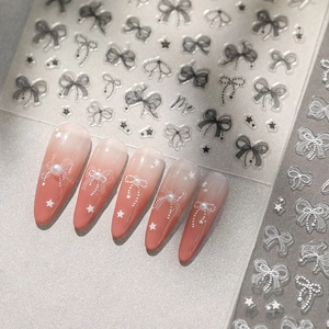 5D embossed nail art stickers with pink gradient nails, pearls and white bow designs