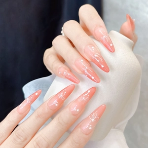 Macro detail of 5D relief nail art with pink gradient, white bows and star accents