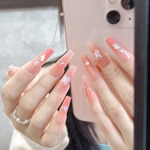 Pink gradient long coffin press-on nails with snowflakes, pearls, and rhinestones