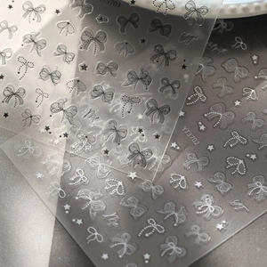 Detailed 5D embossed nail stickers featuring elegant bow and star designs, style YT3703