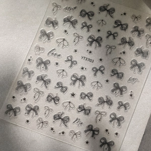 Detailed 5D embossed nail art stickers with black bows, stars and love lettering