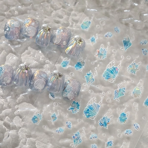 Macro detail of 3D shell texture nail art with aurora purple finish and pearl accents