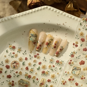 Detailed view of vintage oil painting nail stickers with floral and portrait motifs