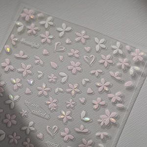 Pink cherry blossom nail art stickers with iridescent shell heart and petal designs